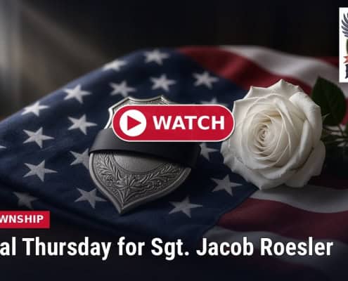 Fostoria News Memorial service for Sgt. Jacob Roesler with American flag and white rose.